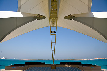 Image showing Modern Abu Dhabi structure framing sea and island