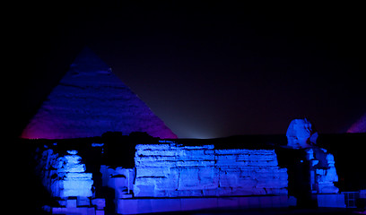 Image showing Colored lights illuminate Sphinx and Pyramids