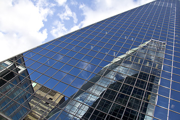 Image showing Reflection of buildings on a glass building