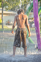 Image showing A kid playing in a water splash park