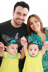 Image showing Young family with twin girls