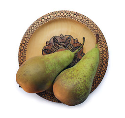 Image showing Two Pears on Wooden Plate