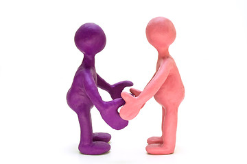 Image showing Colored plasticine puppets standing opposite each other