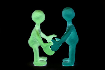 Image showing Shaded plasticine puppets standing opposite each other