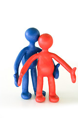 Image showing colored plasticine puppets standing on white background