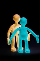 Image showing Shaded plasticine puppets standing on black background