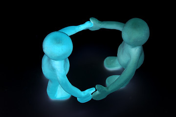 Image showing Dancing plasticine puppets pair on black background