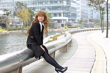 Image showing asia business woman sitting outdoor