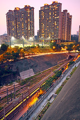 Image showing City and train rail, sunset moment