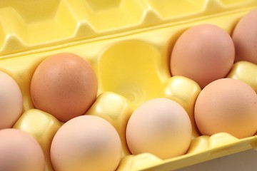 Image showing Eggs in yellow packing box.