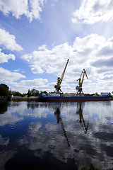 Image showing crane silhouette on dock and river