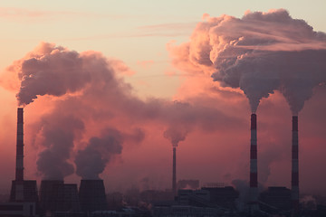 Image showing Tube with smoke on winter sunset