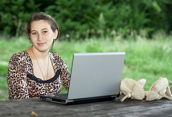 Image showing Young girl with laptop