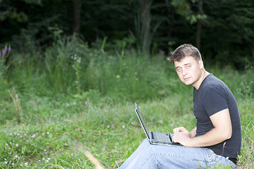 Image showing The young man laptop