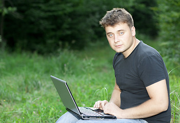 Image showing The young man laptop