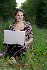 Image showing Young girl with laptop