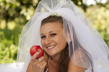 Image showing Bride with apple