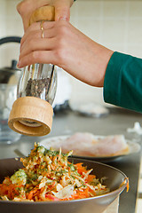 Image showing chef making salad