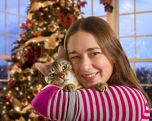 Image showing Bengal cat on girls arm