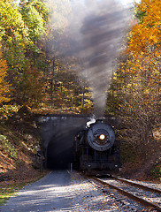 Image showing Steam locomotive leaving tunnel