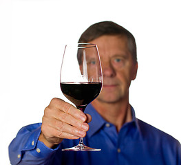 Image showing Senior man with glass of red wine