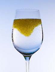 Image showing Olive oil stirred into wine glass