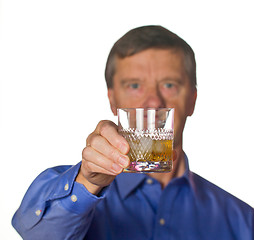 Image showing Senior man with glass of whisky