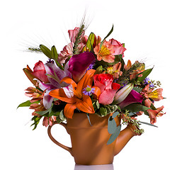 Image showing Bouquet of flowers in watering can