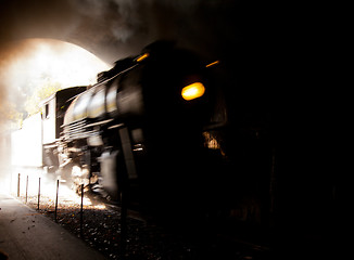 Image showing Steam locomotive enters tunnel