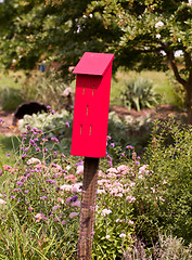 Image showing Red bird house for tits