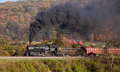Image showing WM Steam train powers along railway