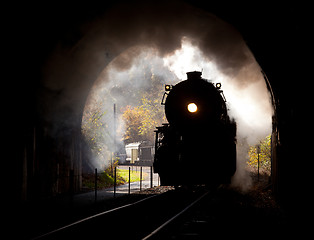 Image showing Steam locomotive enters tunnel