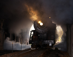 Image showing Steam locomotive enters tunnel