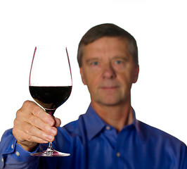 Image showing Senior man with glass of red wine