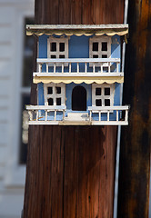 Image showing Ornate blue bird house on pole