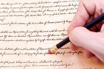 Image showing Closeup of Hand Pencil Erasing First Amendment to U.S. Constitut