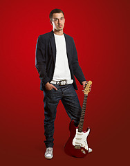 Image showing stylish man with guitar looking at camera