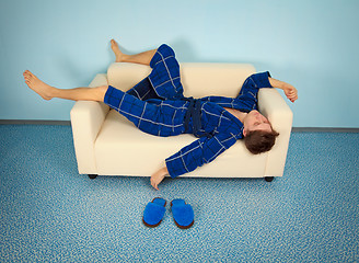 Image showing Tired manual worker is resting at home