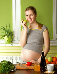 Image showing pregnant woman on kitchen