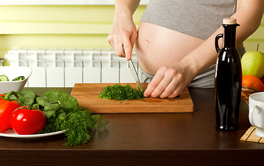 Image showing pregnant woman on kitchen