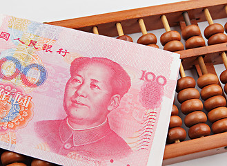 Image showing abacus and china dollar banknote