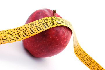 Image showing Apple and measuring tape on white