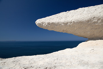 Image showing eroded chalk rock white stone blue sky and sea