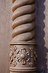 Image showing Carved brown home column. Architectural detail.