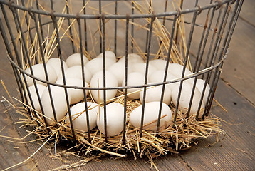 Image showing Eggs in vintage metal egg basket