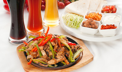 Image showing original fajita sizzling hot  on iron plate