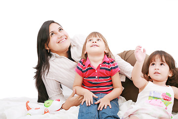 Image showing Happy caucasian mother and two daughter playing and looking up