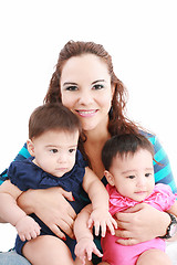 Image showing Happy young mother with two babies on a white background.