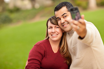 Image showing Attractive Mixed Race Couple Taking Self Portraits