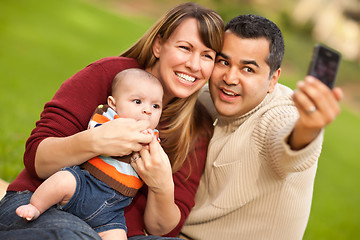 Image showing Happy Mixed Race Parents and Baby Boy Taking Self Portraits